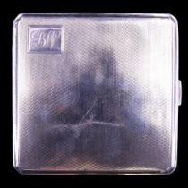 A 1930s silver cigarette case having linear engine-turned decoration and a gilt interior, Thomas