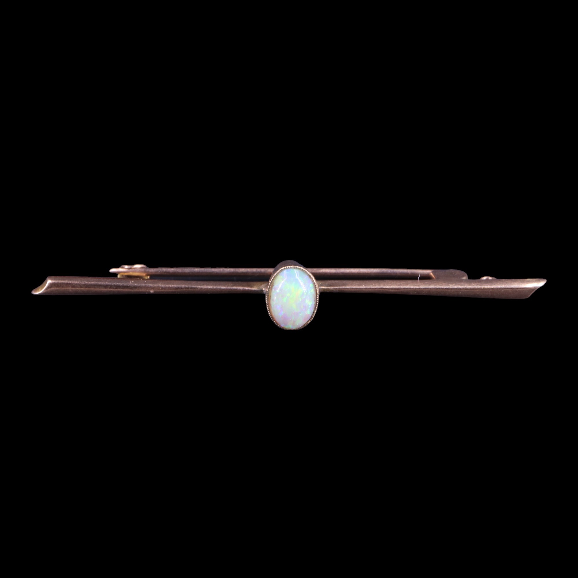 An opal bar brooch, comprising an oval opal cabochon of approx 0.5 cts, millegrain-bezel-set on a - Image 2 of 3