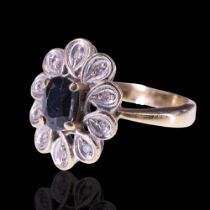 A vintage sapphire and white stone ring, comprising an oval-cut sapphire of approx 0.6 cts claw-