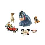 A group of Disney ceramics comprising a large Eeyore money bank, Mickey and Minnie Mouse wall