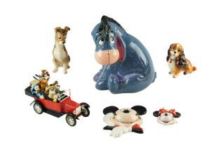 A group of Disney ceramics comprising a large Eeyore money bank, Mickey and Minnie Mouse wall