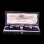 A cased set of late Victorian silver shirt studs in the form of flaming bombs, each 12 mm x 10 mm