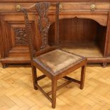An 18th Century and later carved oak yoke-back dining chair