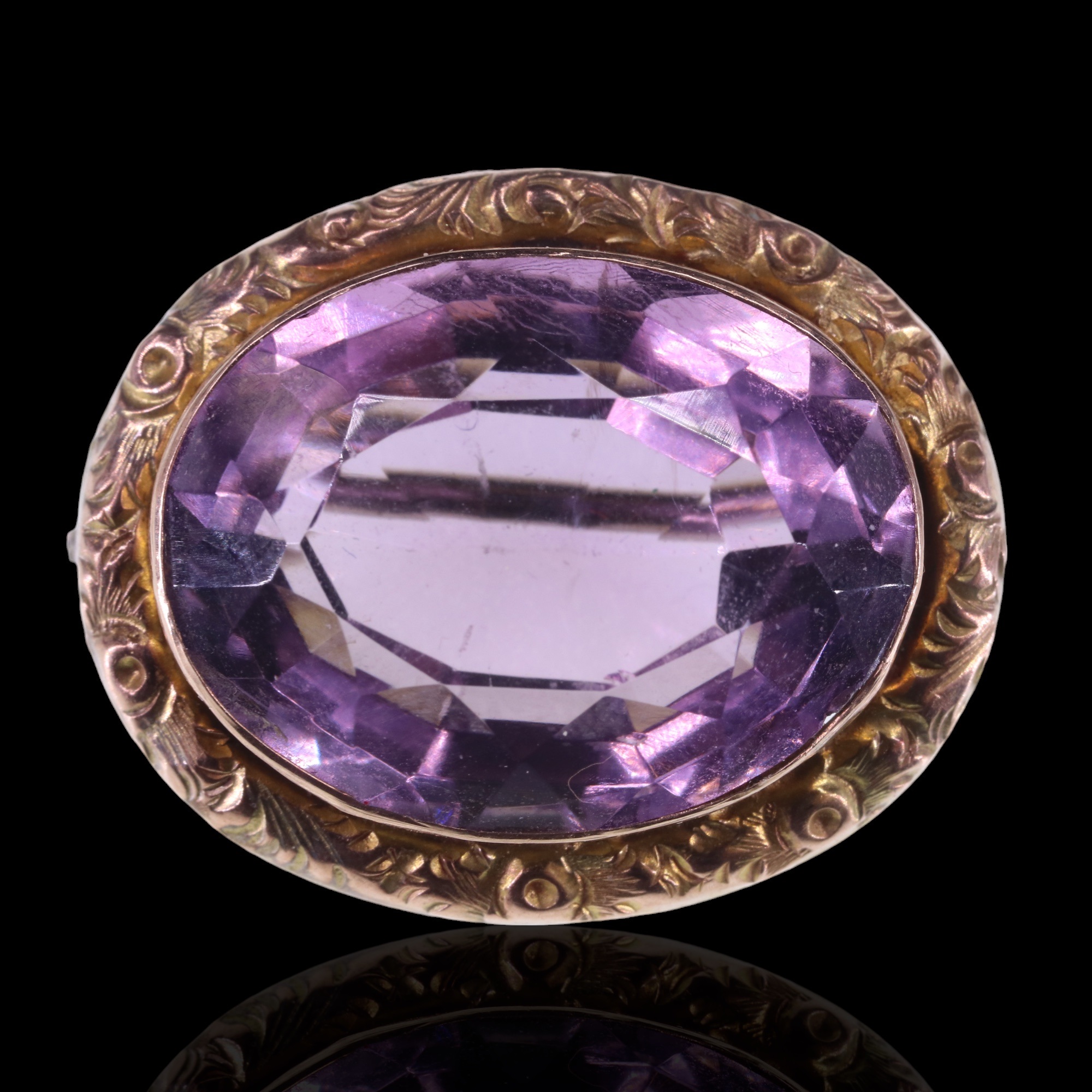 A late 19th / early 20th Century amethyst brooch, the oval cut stone of approx 188 mm x 15 mm