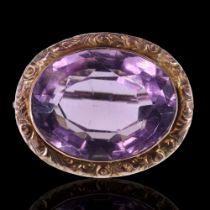 A late 19th / early 20th Century amethyst brooch, the oval cut stone of approx 188 mm x 15 mm