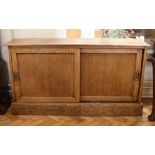 A late 19th / early 20th Century office oak and pine sliding-door cabinet, 128 cm x 30 cm x 70 cm
