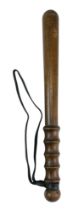 A Police wooden truncheon, turned beech wood with leather wrist strap, second half 20th Century,