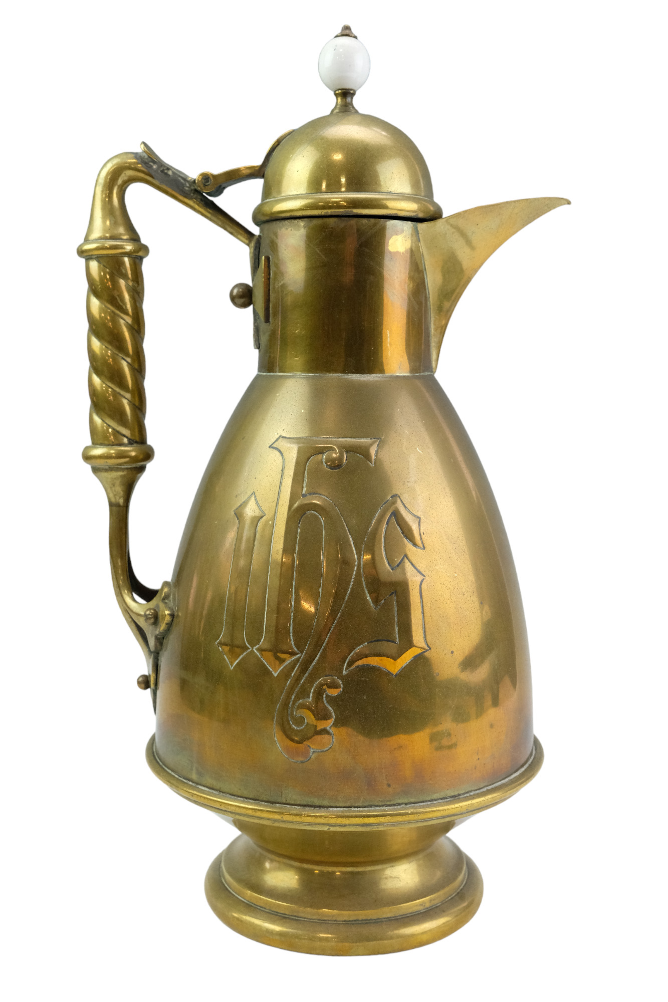 A large Gothic Revival Christian baptismal ewer, in brass with a white earthenware finial, late 19th