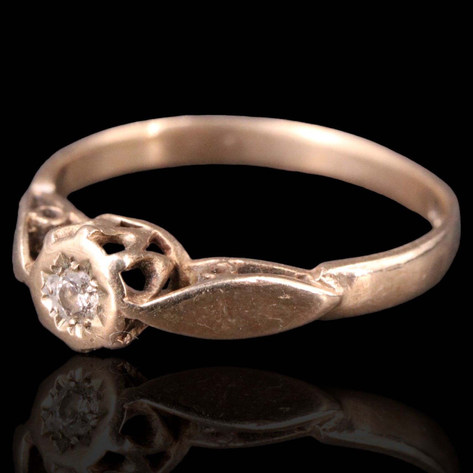 A solitaire diamond ring, having an illusion set 2.5 mm diamond brilliant set on an open gallery