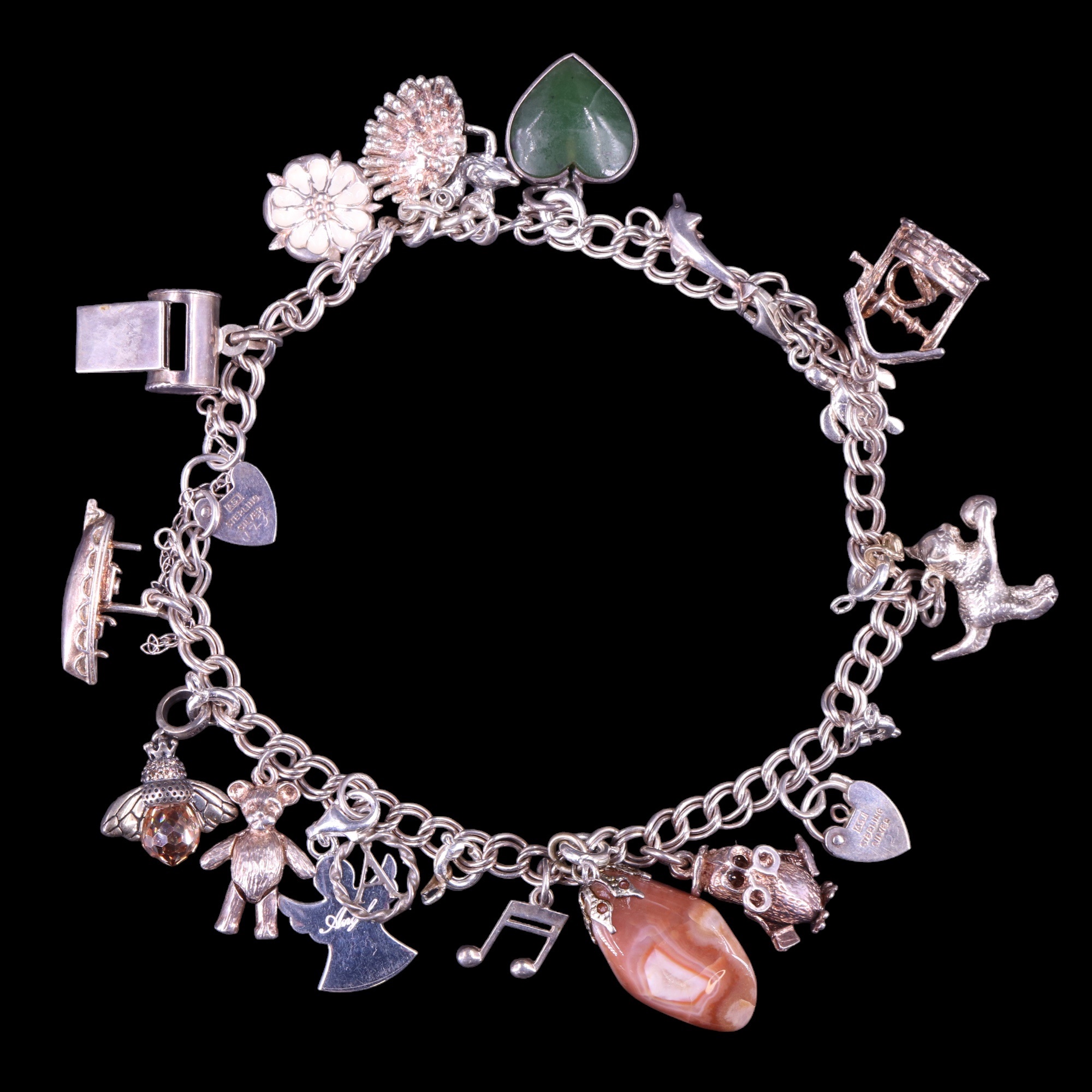 A near-contemporary silver charm bracelet, 47 g