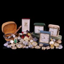 A large quantity of vintage wrist and other watches and travel clocks