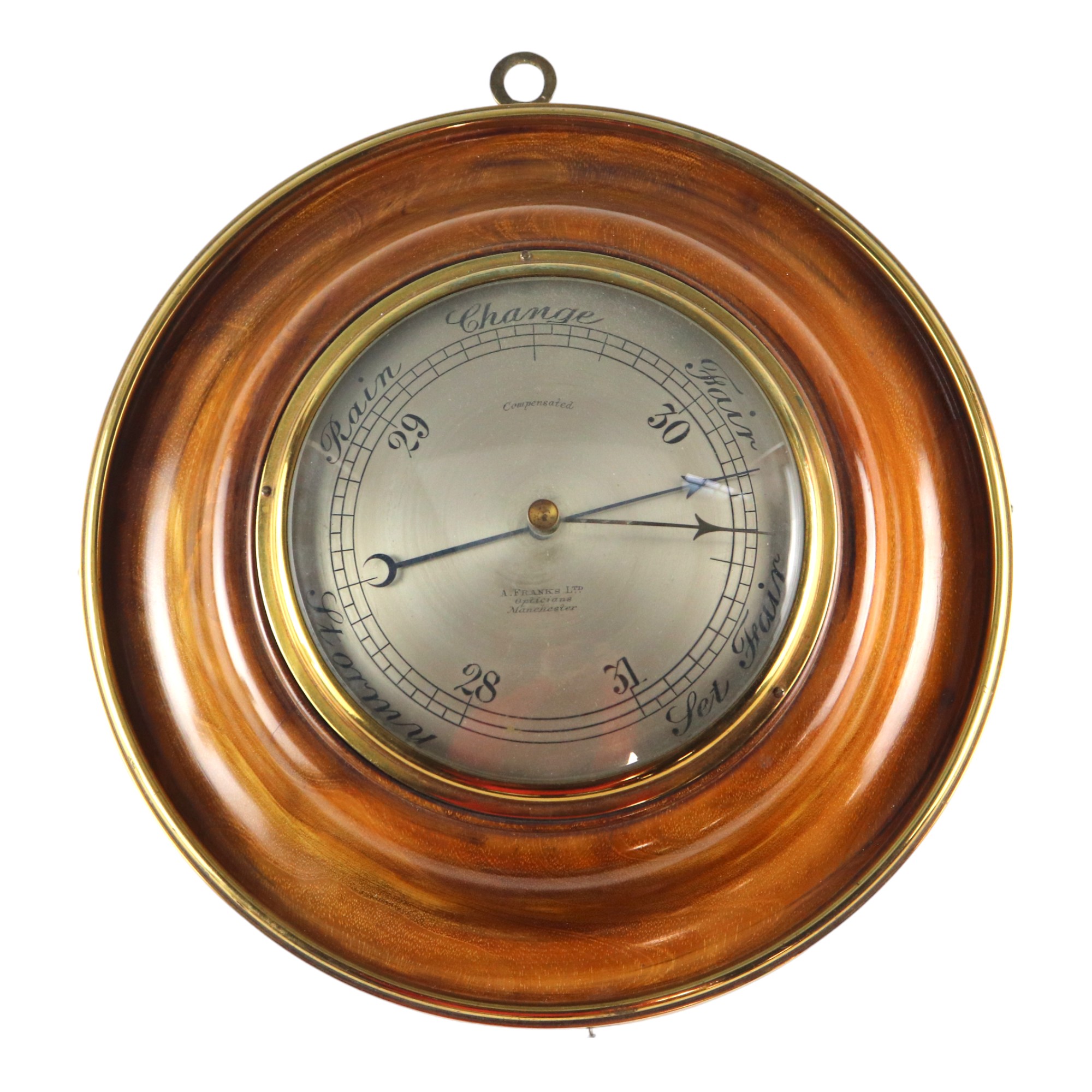 Am aneroid wall barometer by A Franks Ltd, opticians, Manchester, having a convex silvered dial