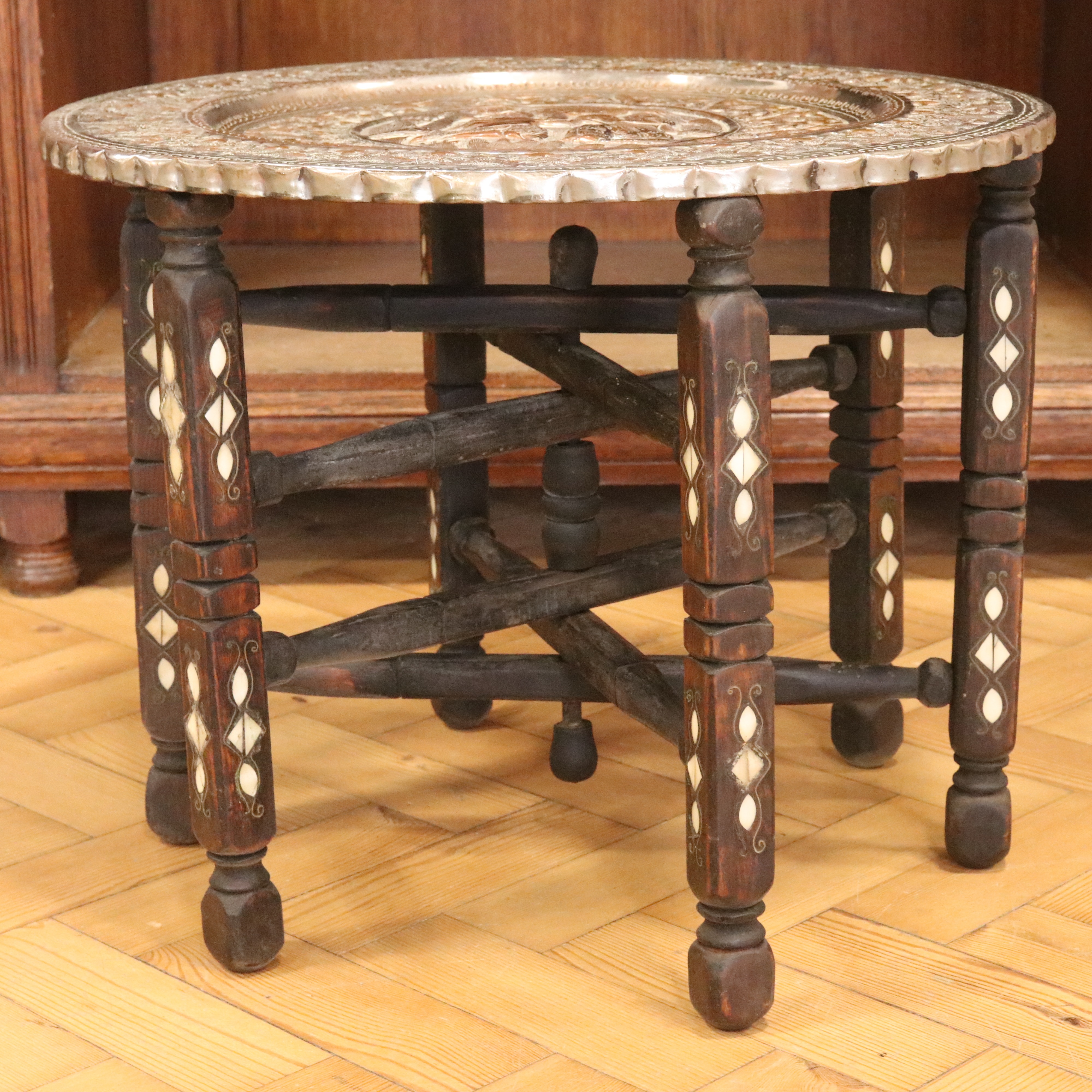 An early-to-mid 20th Century Persian copper-topped and mother-of-pearl inlaid folding table, 52 cm x - Image 2 of 4