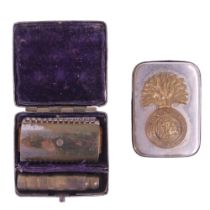 An early 20th Century travel razor and match case, each bearing an applied Northumberland