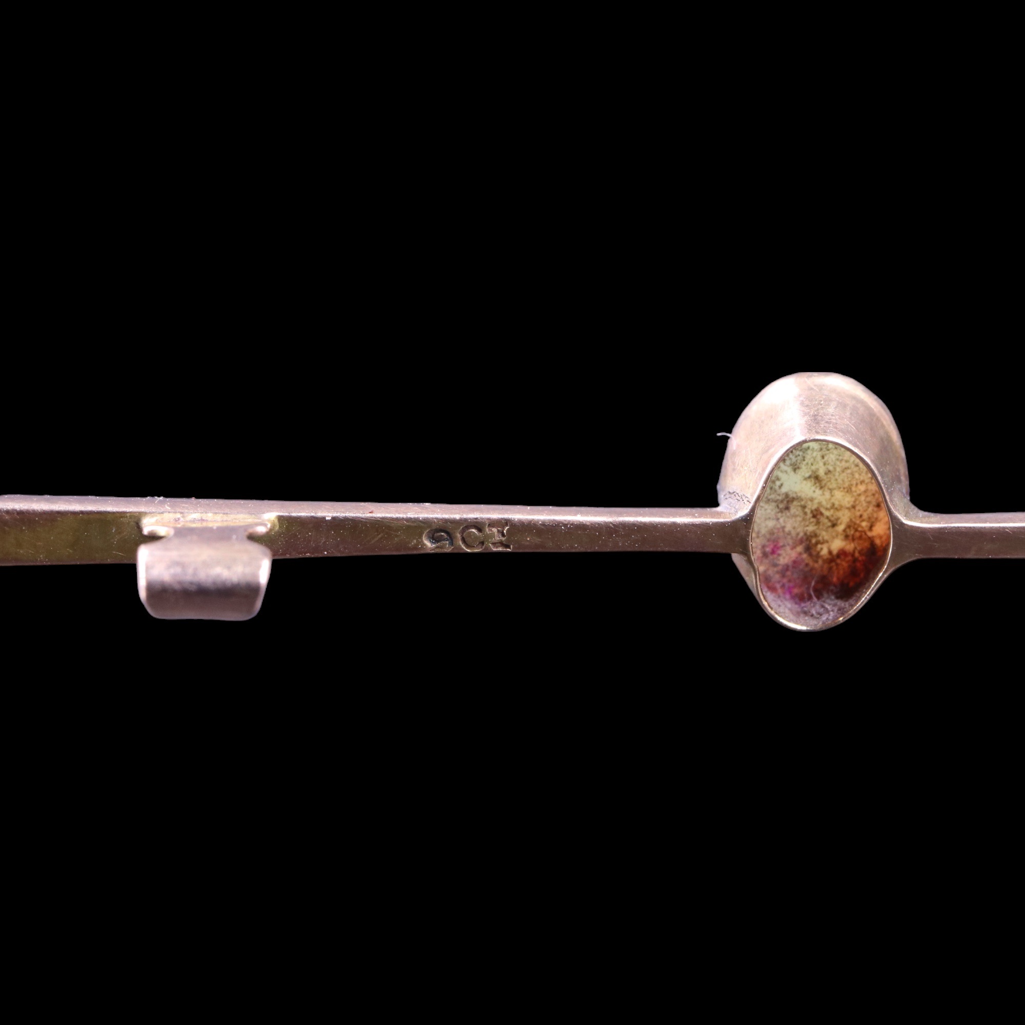 An opal bar brooch, comprising an oval opal cabochon of approx 0.5 cts, millegrain-bezel-set on a - Image 3 of 3