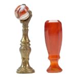 A 19th Century carnelian desk seal together with a brass and agate "claw-and-ball" seal or tamper,