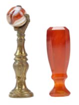 A 19th Century carnelian desk seal together with a brass and agate "claw-and-ball" seal or tamper,