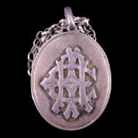 A Victorian silver pendant double locket, of oval form and faced with an applied monogram, 4 cm
