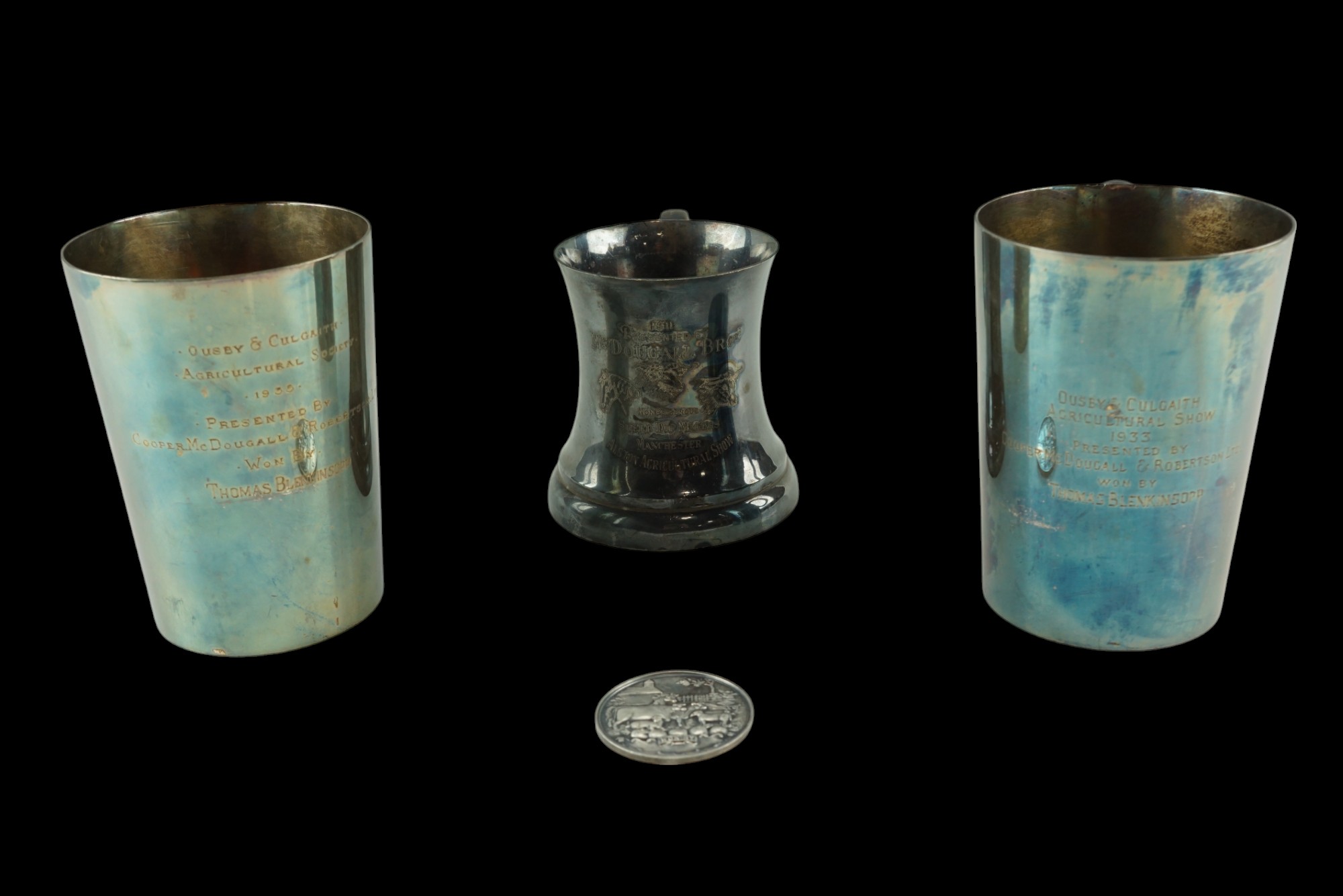 Three Agricultural Society electroplate tankards, earliest 1911, together with a championship medal