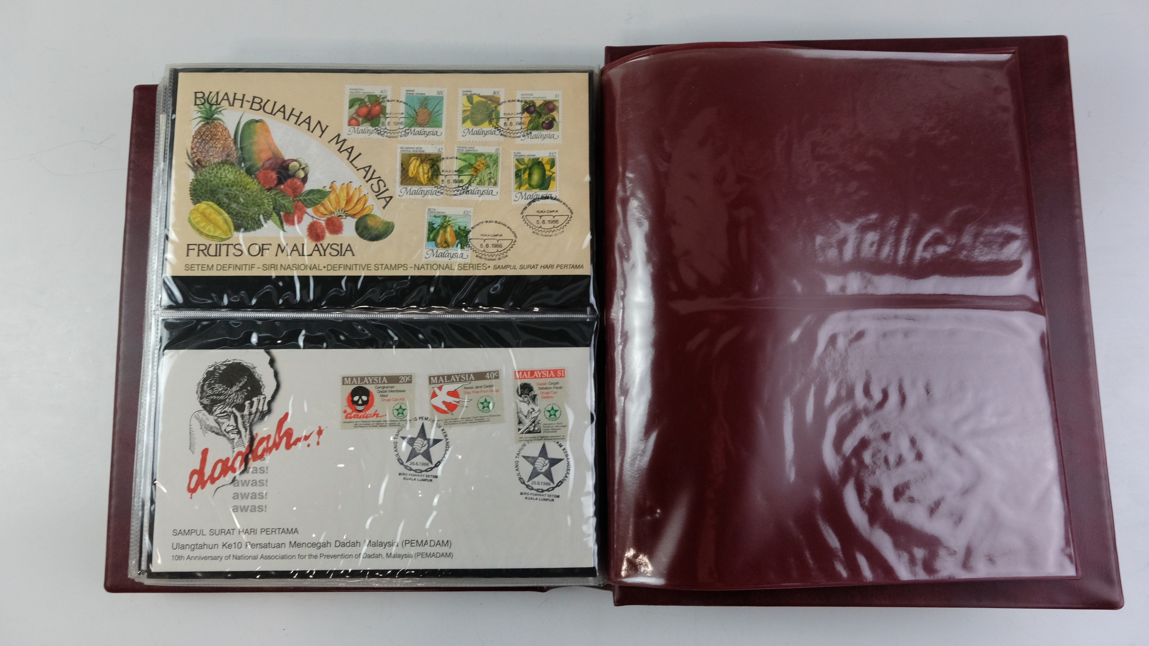 A large quantity of albums containing various world stamp covers including royal commemoratives, - Image 144 of 154