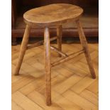 A late 19th / early 20th Century elm-seated stool, 36 cm x 25 cm (seat) x 45 cm high