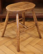 A late 19th / early 20th Century elm-seated stool, 36 cm x 25 cm (seat) x 45 cm high