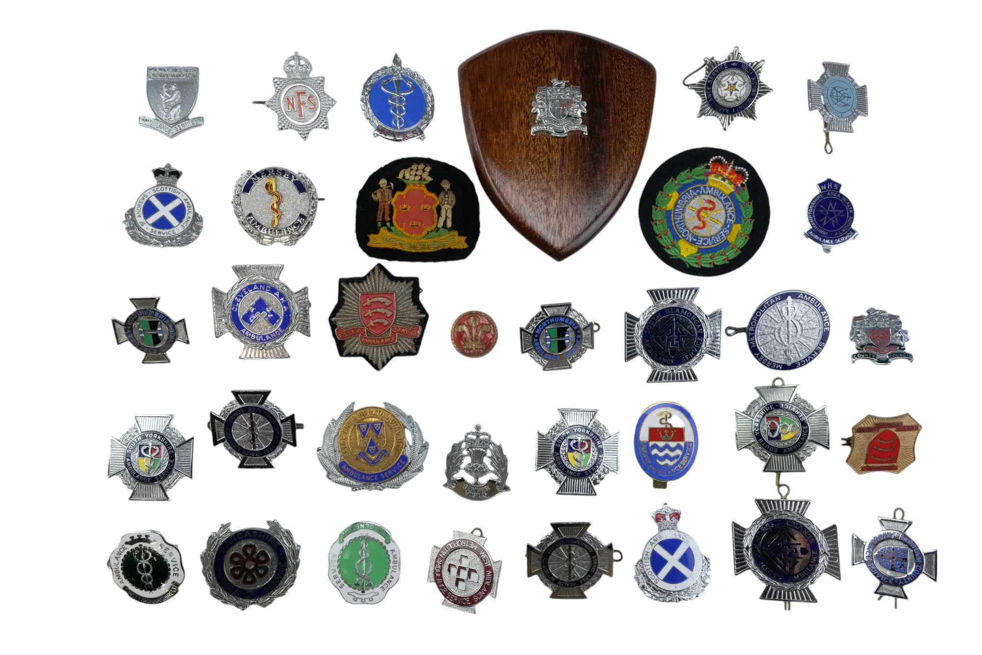 A group of 20th Century Ambulance Service badges together with Scottish Constabulary, National