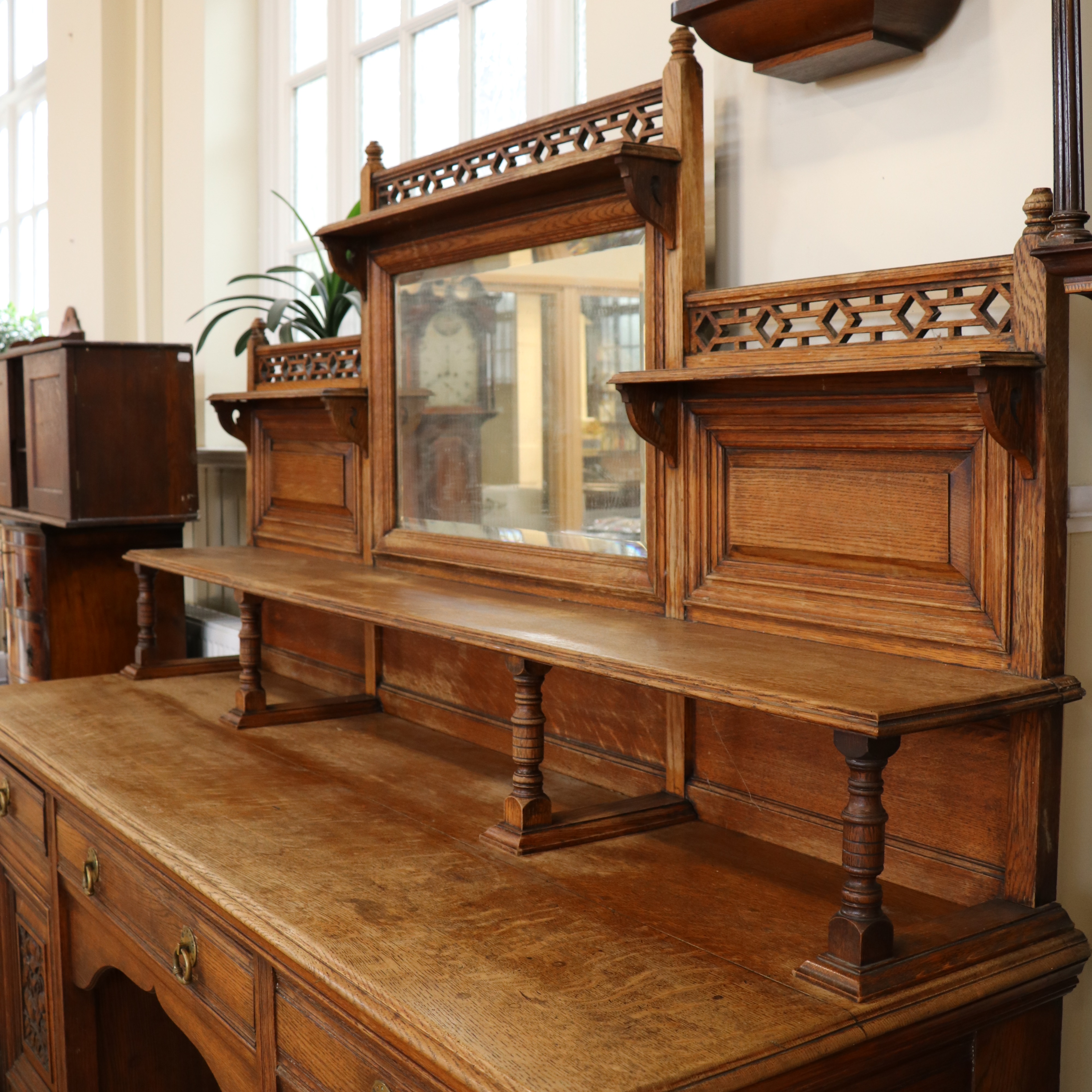 A late / early 20th Century mirror-backed oak sideboard, 204 cm x 63 cm x 196 cm high - Image 2 of 5