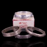 Four various vintage silver hinged bangles