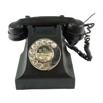 A 1950s/1960s GPO 300 series Bakelite rotary dial telephone