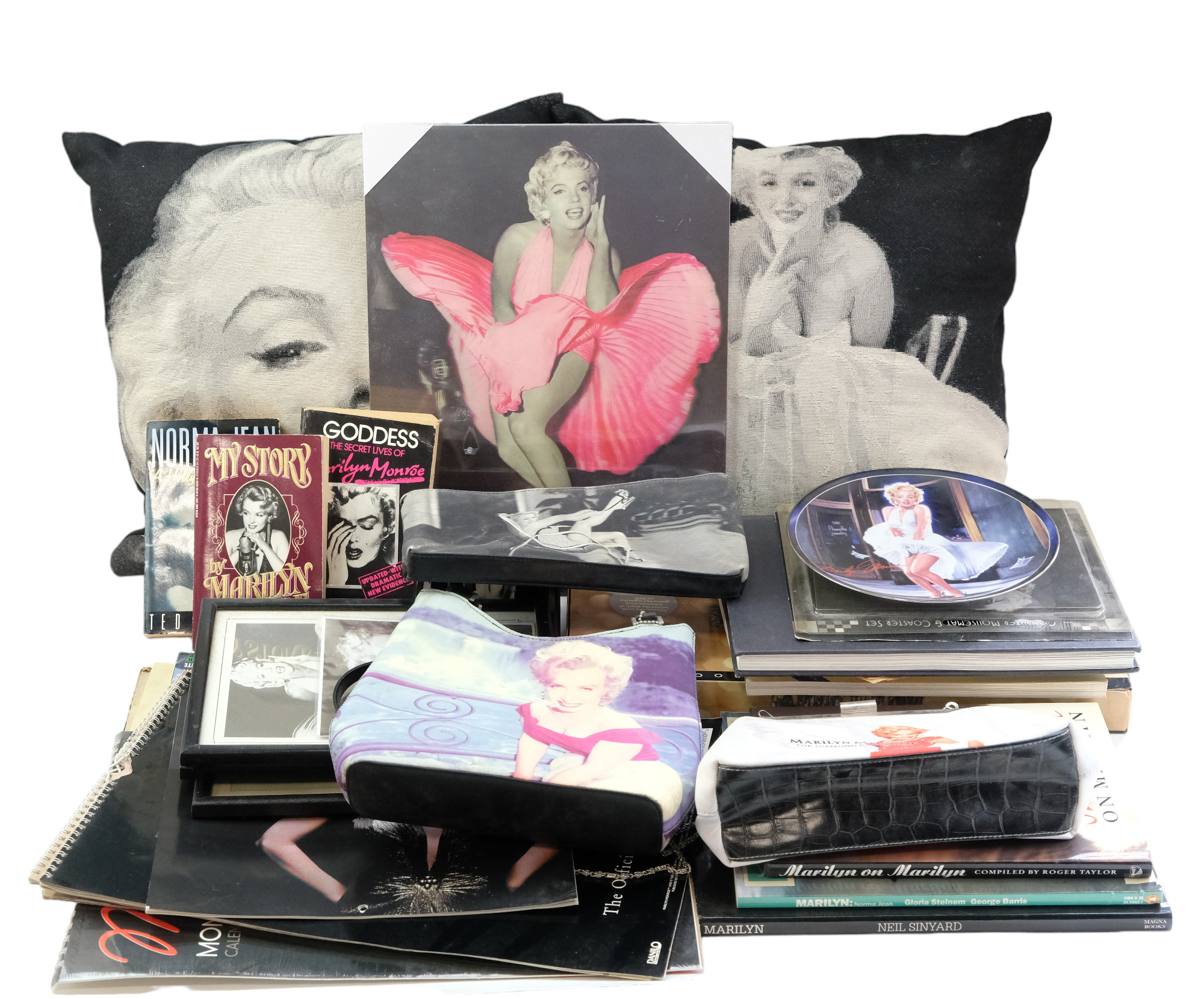 A collection of Marilyn Monroe memorabilia including bags, books, etc