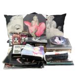 A collection of Marilyn Monroe memorabilia including bags, books, etc