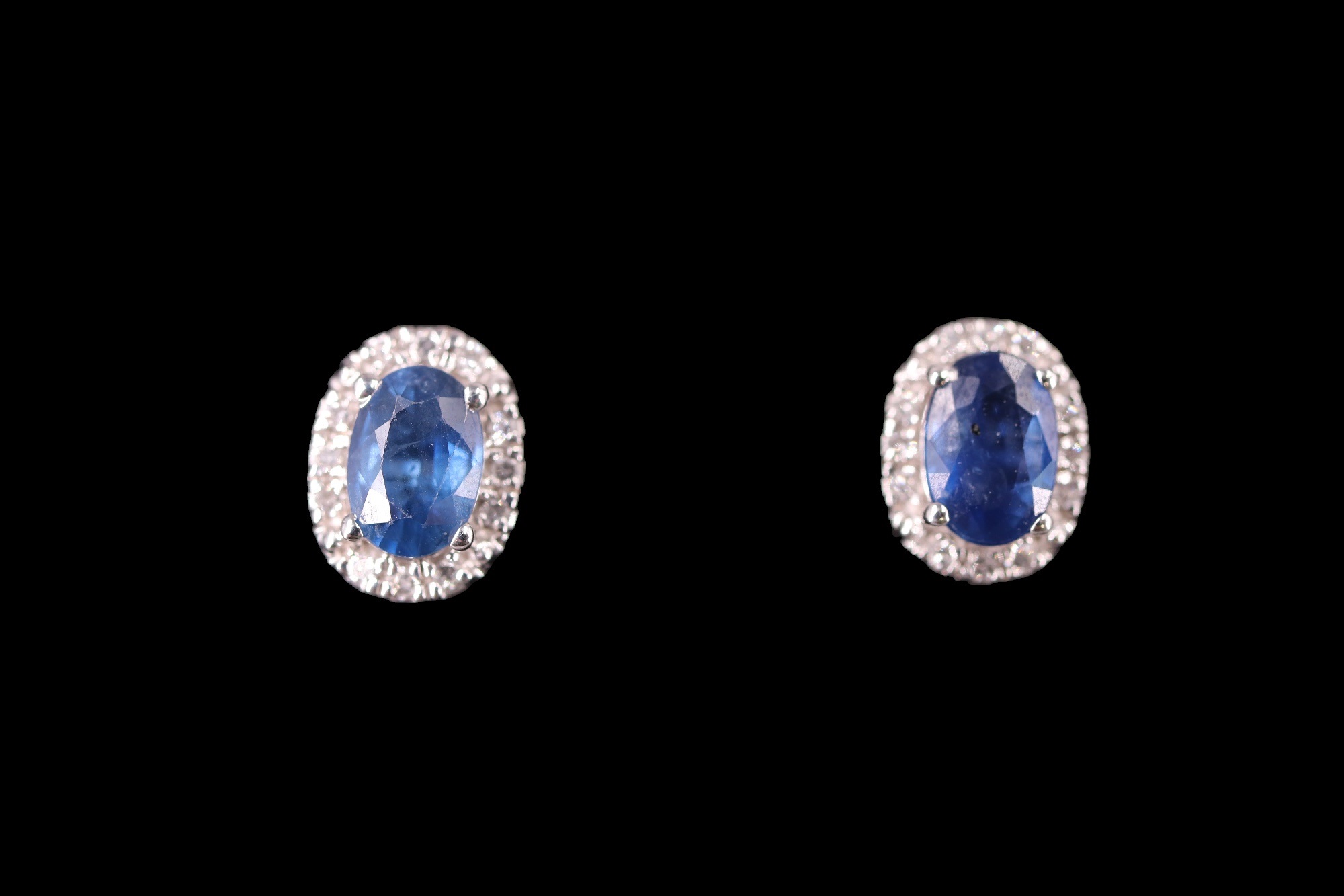 A pair of contemporary sapphire and diamond earrings, each comprising an oval-cut sapphire of approx - Image 2 of 4