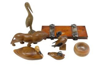 A small quantity of wooden animal figurines including a family of ducks made by the Wichi of