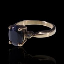 A sapphire and diamond ring, comprising an oval-cut sapphire of approx 2 ct, claw-set on a 9 ct gold