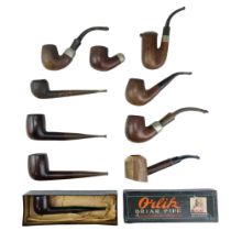 A group of vintage tobacco pipes including two electroplate collared K&P Petersons, an Orlik Briar