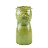 A late 19th / early 20th Century folk art / craft pottery green glazed earthenware mask jug,