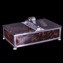 A George V silver and tortoiseshell table box, of rectangular form, having a pair of hinge-lidded