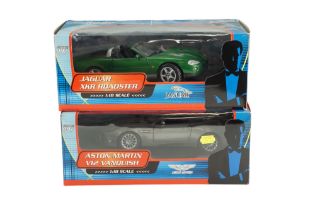 Two boxed James Bond diecast model cars including a Jaguar XKR Roadster and Aston Martin V12