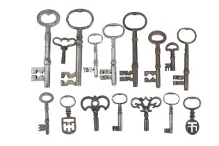 A collection of Georgian and later keys including two 19th Century Odell or latchkeys commonly