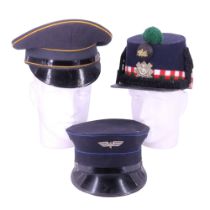 A reproduction Highland Light infantry shako together with two other caps