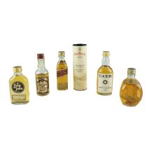 A group of whisky and other miniatures including Dimple Haig, etc