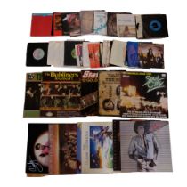 A quantity of vinyl record albums and singles including Madonna, Fleetwood Mac, Status Quo, etc