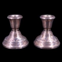 A pair of 1977 silver candle stands, 6.5 cm, 185 g, (loaded)