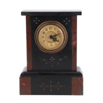 A German gilt-enriched, polished black slate and red marble mantle clock of diminutive stature,