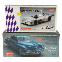 Two Kyosho diecast model cars comprising a BMW V12 LMR and a Tucker Torpedo 1848, 1:18 scale