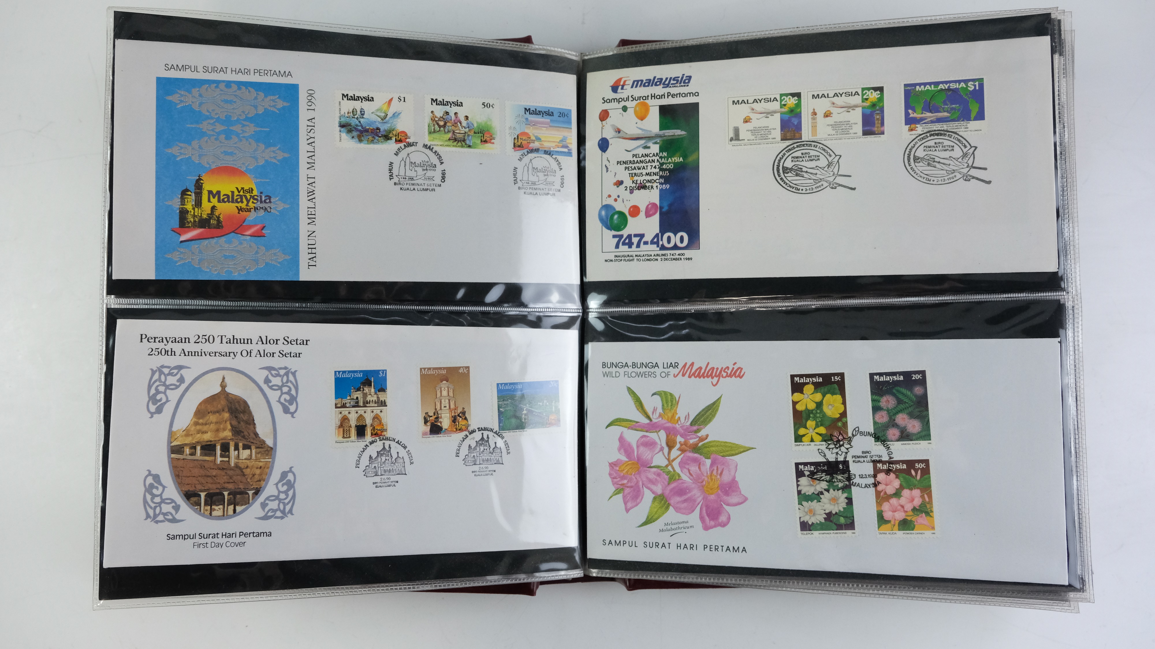 A large quantity of albums containing various world stamp covers including royal commemoratives, - Image 136 of 154