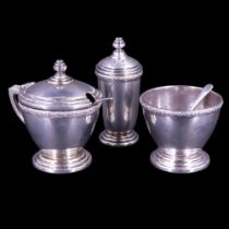 A 1930s Art Deco influenced silver three-piece condiment set comprising a pepperette, mustard pot,