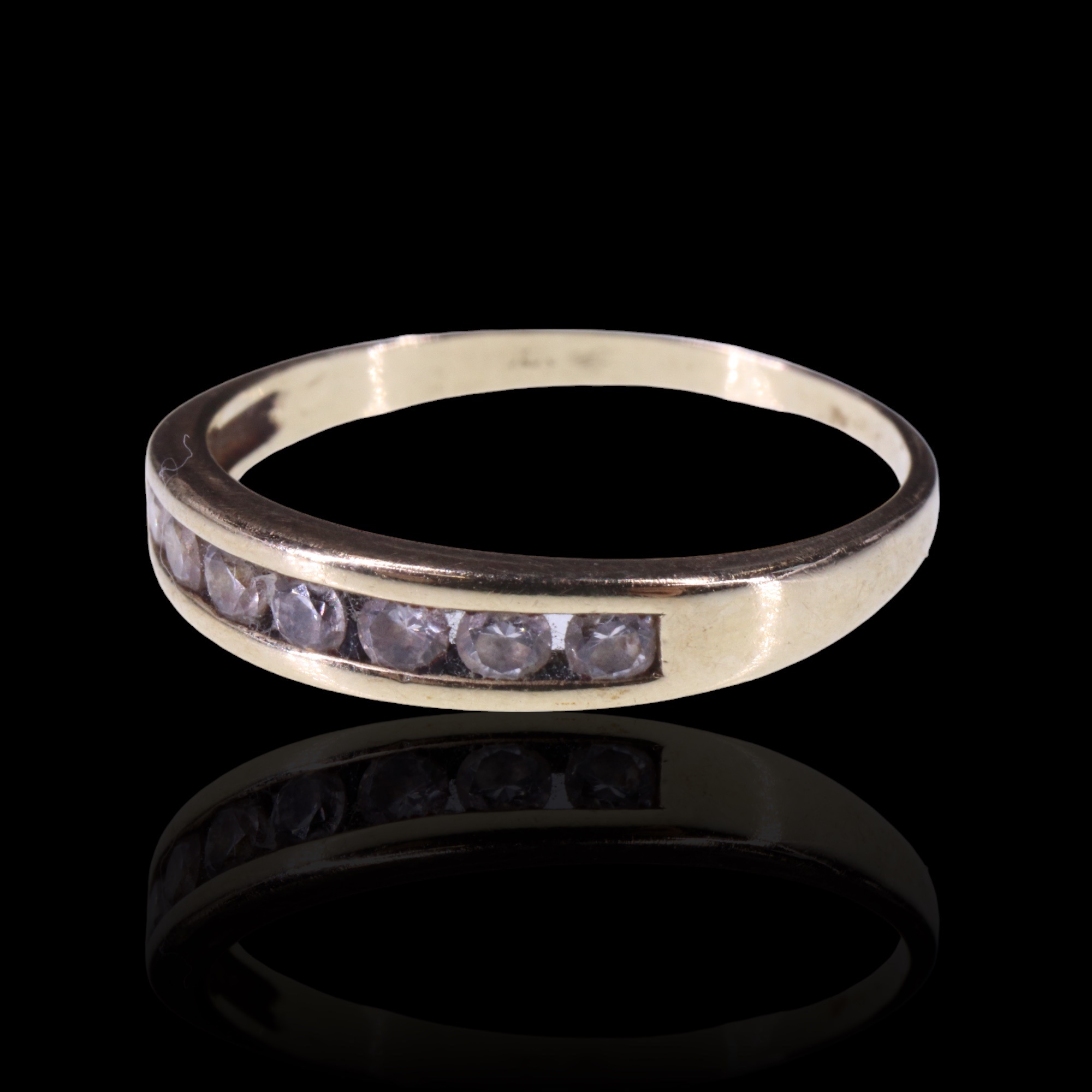 A contemporary channel-set paste and 9 ct yellow metal half-hoop eternity ring, Q/R, 1.6 g