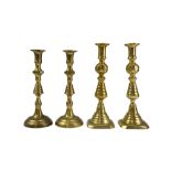 A pair of Victorian brass candlesticks, 28 cm, and one other pair